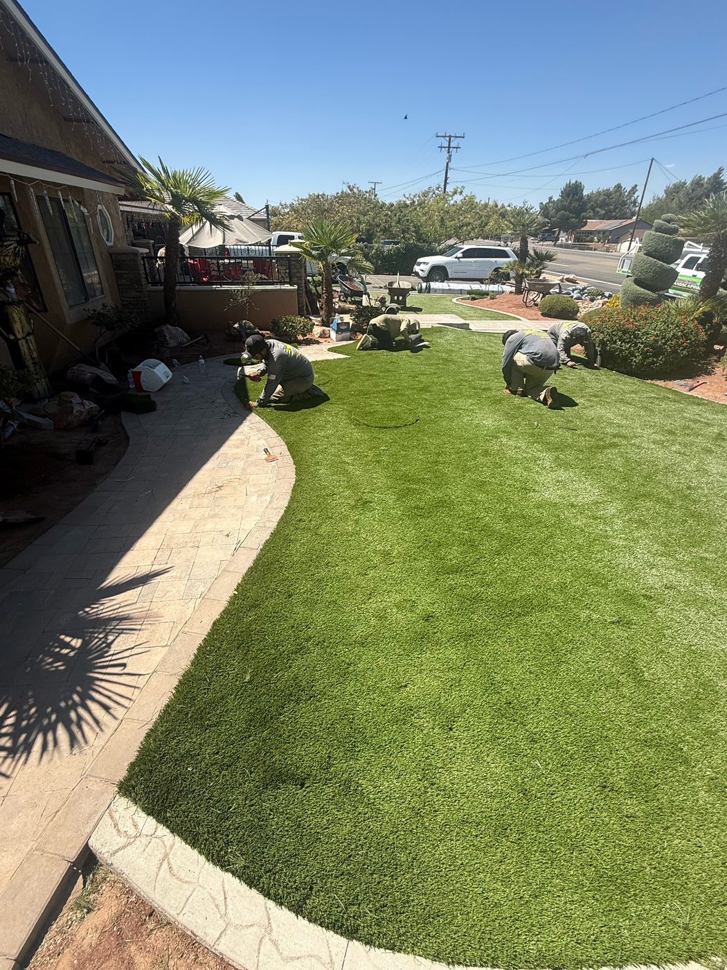 Crew installing artificial turf