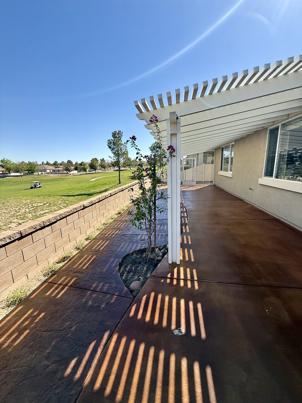 Stained concrete under pergola